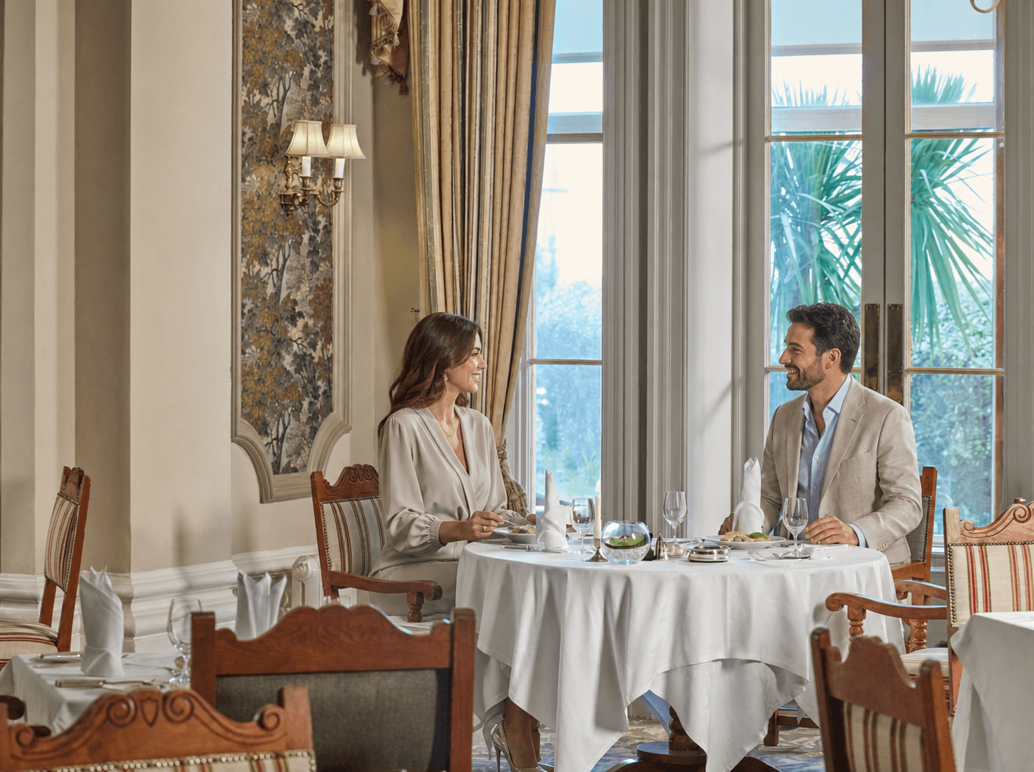 Couple dining in a refined hotel restaurant